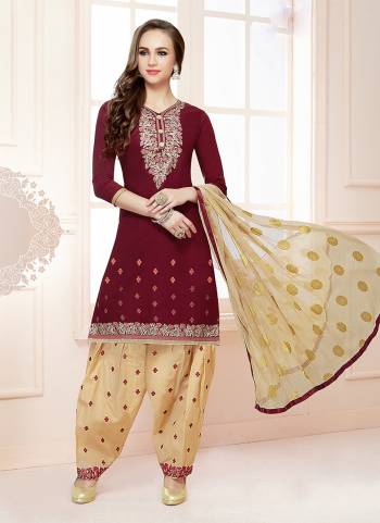 Add This Pretty Dress Material To Your Wardrobe In Maroon Colored Top Paired With Cream Colored Bottom And Dupatta. Its Top And Bottom Are Fabricated On Cotton Paired With Chiffon Dupatta. Buy This Now.