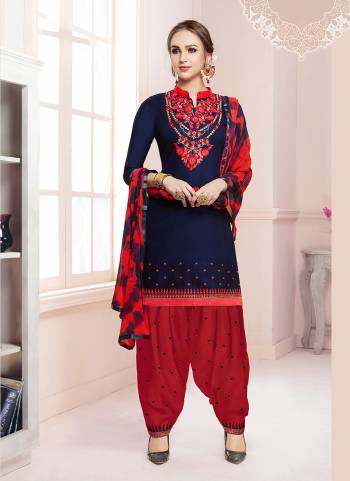 Enhance Your Personality With This Dress Material In Navy Blue Colored Top Paired With Contrasting Red Colored Bottom And Blue And Red Dupatta. Its Top And Bottom Are Cotton Based Paired With Chiffon Dupatta. 