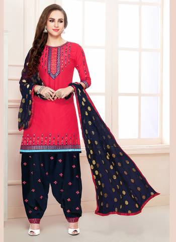 Shine Bright In This Attractive Dark Pink Colored Dress Material Paired With Navy Blue Colored Bottom. Its Top And Bottom Are Fabricated On Cotton Paired With Chiffon Dupatta. Buy This Dress Material Now.