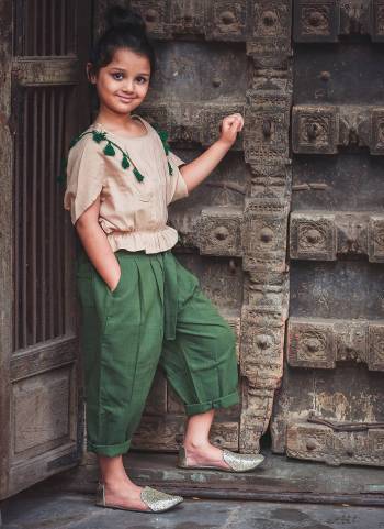 Be It Party Wear Or For An Outing This Lovely Pair Of Top And Pants Is Suitable For All. Its Top Is In Beige Color Paired With Green Colored Bottom. This Khadi Cotton Based Dress Is Available In Sizes, Choose As Per Your Desired Comfort. Buy Now.