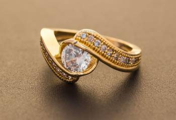 Grab This Beautiful And Elegant Looking Solitare Pattern Ring In Golden Color Beautified With Diamond Work. This Ring Will Give An Elegant Look To Your Hand. It Is Available In Sizes, Choose As Per Your Fit And Comfort. 