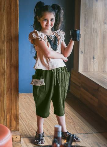 Olive Green Colored khadi  calf length pant Paired With Beige frill sleeves top with hand made tringle path lace 