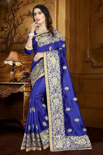 Enhance Your Perosnality Wearing This Designer Silk Saree In Navy Blue Color Paired With Navy Blue Colored Blouse. This Saree And Blouse are fabricated On Art Silk Beautified With Heavy Resham Embroidery And Lace Border. 