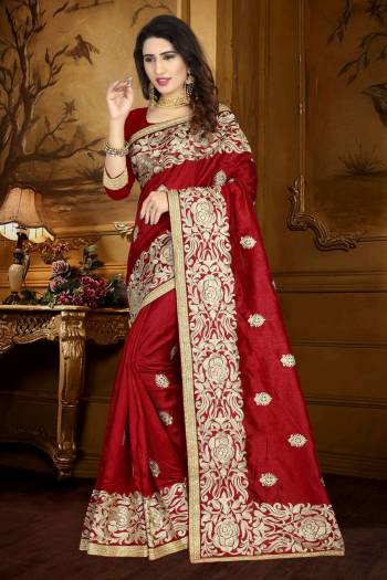 For A Royal Queen Look, Grab This Saree In Maroon Color Paired With Maroon Colored Blouse. This Saree And Blouse Are fabricated On Art Silk Beautified With Heavy Resham Embroidery And Lace Border. 