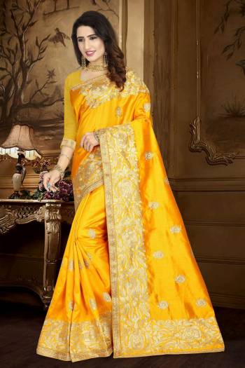 Celebrate This Festive Season Wearing This Designer Silk Based Saree In Musturd Yellow Color Paired With Musturd Yellow Colored Blouse. It Is Beautified With Heavy Resham Embroidery And Lace Border.