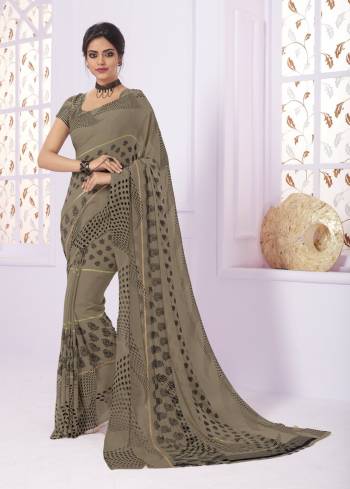 Flaunt Your Rich and Elegant Taste Wearing This Saree In Grey Color Paired With Grey Colored Blouse. This Saree Is Fabricated On Georgette Paired With Creoe Fabricated Blouse. It Has Pretty Small Prints Over The Saree.