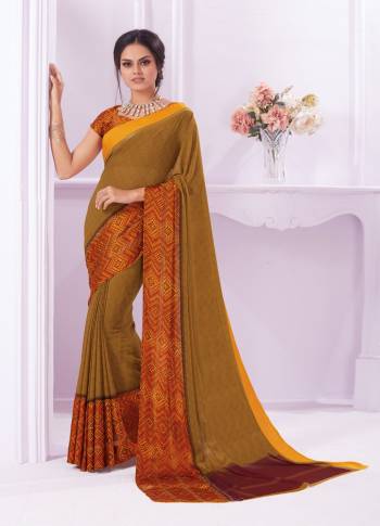 Add This Beautiful Olive Green Colored Saree Fabricated On Georgette Paired With Crepe Fabricated Blouse. It Is Beautified with Printed And Lace Border. Also It Is Light Weight And easy To Carry All Day Long.