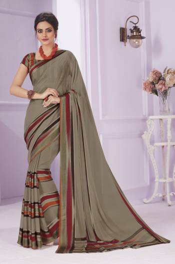 Flaunt Your Rich and Elegant Taste Wearing This Saree In Grey Color Paired With Grey Colored Blouse. This Saree Is Fabricated On Georgette Paired With Creoe Fabricated Blouse. It Has Pretty Small Prints Over The Saree.