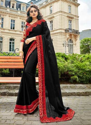 For A Bold And Beautiful Look, Grab This Beautiful Designer Saree In Black Color Paired With Black Colored Blouse. This Saree IS Georgette Fabricated Paired With Art Silk And Net Fabricated Blouse. Buy This Saree Now.