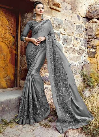 Flaunt Your Rich And Elegant Look, Wearing This Beautiful Designer Saree In Grey Color Paired With Grey Colored Blouse. This Saree Is Fabricated On Chiffon Paired With Art Silk Fabricated Blouse. This Saree Is Light Weight And Easy To Drape Which Is Easy To Carry All Day Long.