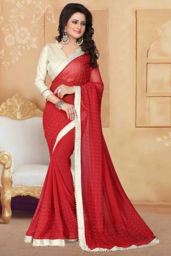 Grab This Elegant Looking Designer Saree For Your Semi-Casual Or Even Party Wear. This Saree Gives An Elegant And Simple Look Which Is Fabricated On Georgette. This Saree Is In Red Color Paired With Cream Colored Blouse. Buy This Saree Now.