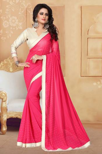 Grab This Elegant Looking Designer Saree For Your Semi-Casual Or Even Party Wear. This Saree Gives An Elegant And Simple Look Which Is Fabricated On Georgette. This Saree Is In Dark Pink Color Paired With Cream Colored Blouse. Buy This Saree Now.