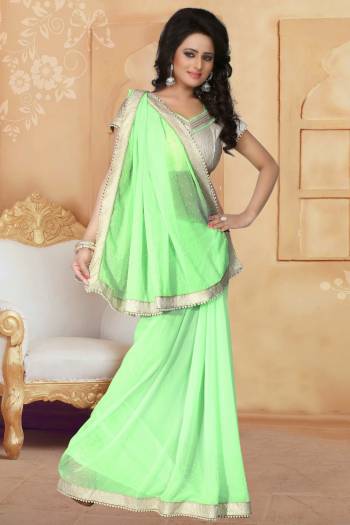 Grab This Elegant Looking Designer Saree For Your Semi-Casual Or Even Party Wear. This Saree Gives An Elegant And Simple Look Which Is Fabricated On Georgette. This Saree Is In Light Green Color Paired With Cream Colored Blouse. Buy This Saree Now.