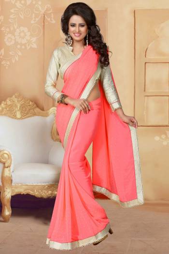 Grab This Elegant Looking Designer Saree For Your Semi-Casual Or Even Party Wear. This Saree Gives An Elegant And Simple Look Which Is Fabricated On Georgette. This Saree Is In Dark Peach Color Paired With Cream Colored Blouse. Buy This Saree Now.