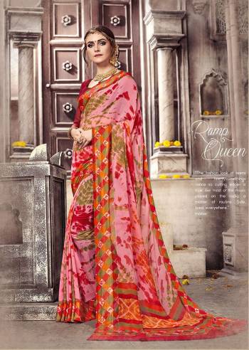 Go Colorful Wearing This Pretty Pink And Multi Colored Saree Paired With Red Colored Blouse. This Saree And Blouse are Fabricated On Georgette Beautified With Prints.