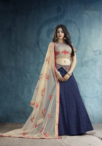 You Will Definitely Earn Lots Of Compliments Wearing This Designer Lehenga Choli In Grey Colored Blouse Paired With Navy Blue Colored Lehenga And Cream Colored Dupatta. Its Blouse Is Art Silk Fabricated Paired With Weaved Silk Fabricated Lehenga And Net Dupatta. Buy This Unique Designer Lehenga Now.