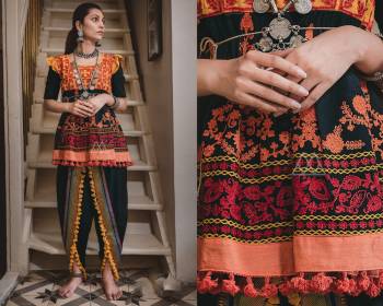 For A Bold and Beautiful Look This Navratri, Grab This Designer Pair Of Kedias For Women In Black Colored Top And Dhoti. Its Top And Bottom are Khadi Based Fabric Beautified With Thread Work And Lace Border. Buy Now.