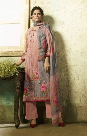 Here Is A Beautiful Shade To Add Into Your Wardrobe In Dusty Pink And Grey Colored Top Paired With Dusty Pink colored Bottom And Dusty Pink And Grey Dupatta. Its Top And Bottom Are Fabricated On Cambric Cotton Paired With Chiffon Dupatta. 