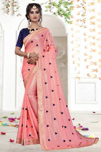 Look Pretty At Your Parties And Festives Wearing This Lovely Designer Saree In Pink Color Paired With Contrasting Navy Blue Colored Blouse. This Saree Is Shimmer Georgette Based Fabric Paired With Brocade Fabricated Blouse. It Is Easy To Drape And Carry Throughout The Gala.