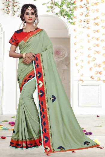 Beautiful Shade In Green Is Here With This Designer Saree In Mint Green Color Paired With Contrasting Red Colored Blouse. This Saree Is Fabricated On Fancy Georgette Paired With Art Silk Fabricated Blouse. It Has Fancy Lace Border Making The Saree Attractive. 