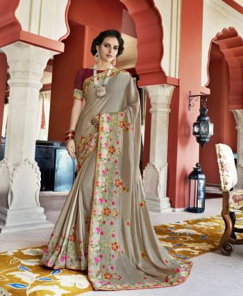 Flaunt Your Rich and Elegant Taste Wearing This Designer Saree In Grey Color Paired with Contrasting Maroon Colored Blouse. This Saree Is Fabricated On Silk Georgette Paired With Art Silk Fabricated Blouse. This Designer Saree Will Definitely Earn You Lots Of Compliments From Onlookers.