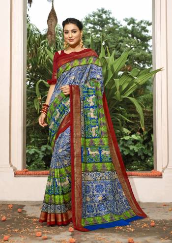 Go Colorful With This Multi Colored Saree Paired With Contrasting Red Colored Blouse. This Saree And Blouse Are Silk Based Fabric Beautified With Prints All Over. 