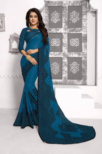 Enhance Your Personality Wearing This Rich And Elegant Looking Saree In Blue Color Paired With Blue Colored Blouse. This Saree And Blouse Are Fabricated On Chiffon Beautified With Simple Geometric Prints. Buy Now.