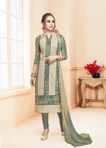 For Your Semi-Casual Wear, Grab This Dress Material In Grey And Cream Color Paired With Grey Colored Bottom And Grey And Cream Dupatta. Its Top And Bottom Are Cotton Based Paired With Chiffon Dupatta. 