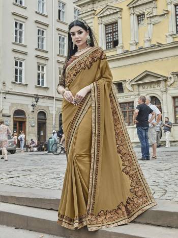 Rich And Elegant Looking Designer Saree Is Here In Beige Color Paired With Contrasting Brown Colored Blouse. This Saree Is Fabricated On Silk Chiffon Paired With Art Silk Fabricated Blouse. Buy This Designer Saree With Rich Combination. Buy Now.