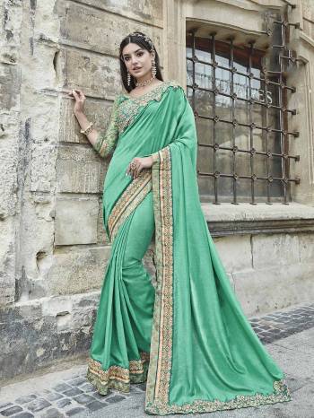 Add This Lovely Designer Saree To Your Wardrobe In Sea Green Color Paired With Sea Green Colored Blouse. This Silk Based Saree Is Paired With Art Silk And Net Fabricated Blouse. It Has Embroidered Lace Border And Blouse. 