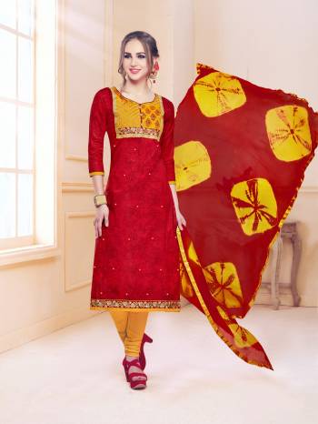 Adorn The Pretty Angelic Look Wearing This Suit In Red Colored Top And Dupatta Paired With Contrasting Yellow Colored Bottom. This Dress Material Is Fabricated On Cotton Paired With Chiffon Dupatta. Buy Now.