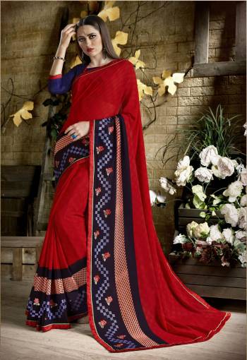 Bright And Visually Appealing Color Is Here In Red Color Paired With Royal Blue Colored Blouse. This Saree Is Fabricated On Georgette Paired With Art Silk Fabricated Blouse. It Has Simple Prints And Thread Work Over The Saree.