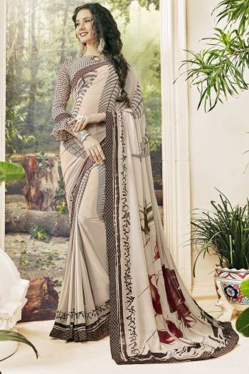 New Shade Is Here In Cream Color With This Dusty Cream Colored Saree Paired With Dusty Cream Colored Blouse. This Saree And Blouse Are Georgette Based Fabric With Bold Prints Over It. 