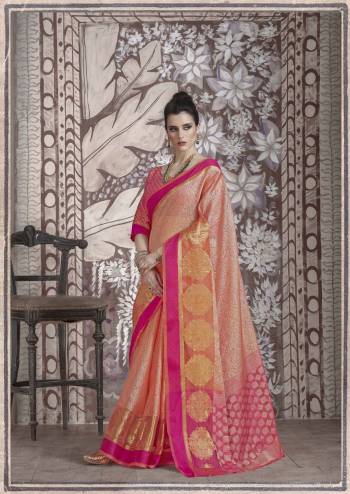 Look Pretty Wearing This Silk Saree In Peach Color Paired With Contrasting Fuschia Pink Colored Blouse. This Saree And Blouse Are Banarasi Muslin Silk Fabricated Beautified With Weave All Over It. Buy This Saree Now.