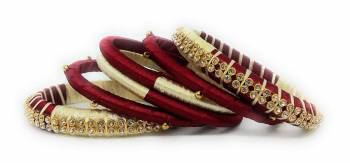 Grab This Beautiful Set Of Four Bangles To Simple Pair Up With Your Ethnic Wear Or You Can Also Mix It With Other Plain Bangles For More Heavy Look. It Is Made With Silk Thread And Beautified With Stone Work, Pair These Up With Same Or Any Contrasting Colored Ethnic Attire.