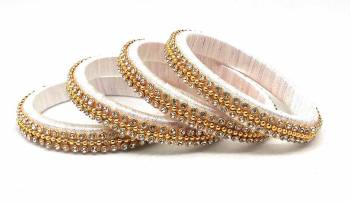 Grab This Beautiful Set Of Four Bangles To Simple Pair Up With Your Ethnic Wear Or You Can Also Mix It With Other Plain Bangles For More Heavy Look. It Is Made With Silk Thread And Beautified With Stone Work, Pair These Up With Same Or Any Contrasting Colored Ethnic Attire.