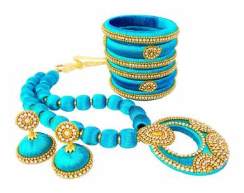 To Give A Heavy Ethnic Look To Your Personality, Grab This lovely Set Of Necklace Set With A Pair Of Matching Earrings And Set Of Bangles. This Set Is Made With Attractive Silk Thread Beautified With Stone Work. You Can Use It As Per Your Occasion With Matching Or Contrasting Colored Ethnic Attire. Buy Now.