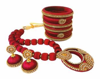 To Give A Heavy Ethnic Look To Your Personality, Grab This lovely Set Of Necklace Set With A Pair Of Matching Earrings And Set Of Bangles. This Set Is Made With Attractive Silk Thread Beautified With Stone Work. You Can Use It As Per Your Occasion With Matching Or Contrasting Colored Ethnic Attire. Buy Now.