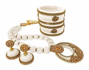 To Give A Heavy Ethnic Look To Your Personality, Grab This lovely Set Of Necklace Set With A Pair Of Matching Earrings And Set Of Bangles. This Set Is Made With Attractive Silk Thread Beautified With Stone Work. You Can Use It As Per Your Occasion With Matching Or Contrasting Colored Ethnic Attire. Buy Now.