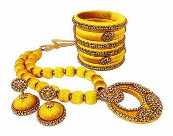 To Give A Heavy Ethnic Look To Your Personality, Grab This lovely Set Of Necklace Set With A Pair Of Matching Earrings And Set Of Bangles. This Set Is Made With Attractive Silk Thread Beautified With Stone Work. You Can Use It As Per Your Occasion With Matching Or Contrasting Colored Ethnic Attire. Buy Now.