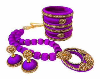 To Give A Heavy Ethnic Look To Your Personality, Grab This lovely Set Of Necklace Set With A Pair Of Matching Earrings And Set Of Bangles. This Set Is Made With Attractive Silk Thread Beautified With Stone Work. You Can Use It As Per Your Occasion With Matching Or Contrasting Colored Ethnic Attire. Buy Now.