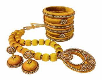 To Give A Heavy Ethnic Look To Your Personality, Grab This lovely Set Of Necklace Set With A Pair Of Matching Earrings And Set Of Bangles. This Set Is Made With Attractive Silk Thread Beautified With Stone Work. You Can Use It As Per Your Occasion With Matching Or Contrasting Colored Ethnic Attire. Buy Now.