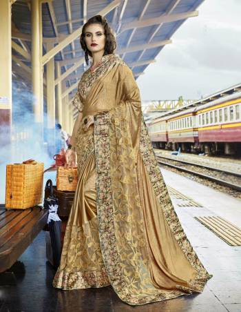 Simple And Elegant Looking Designer Saree Is Here In Beige Color Paired With Beige Colored Blouse. This Saree Is Lycra And Net Based Fabric Paired With Printed Art Silk Blouse. It Has New Fancy Work Over The Saree. Buy Now.