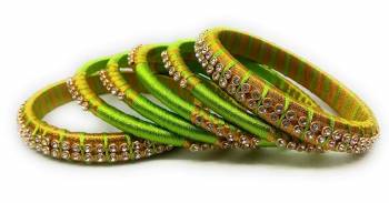 Grab This Beautiful Set Of Six Bangles To Simple Pair Up With Your Ethnic Wear Or You Can Also Mix It With Other Plain Bangles For More Heavy Look. It Is Made With Silk Thread And Beautified With Stone Work, Pair These Up With Same Or Any Contrasting Colored Ethnic Attire.