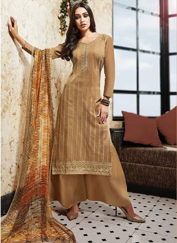 Simple And Elegant Looking Dress Suit Is Here In Beige Color Paired With Beige Colored Bottom And Dupatta. Its Top And Bottom Are Satin Based Paired With Chiffon Dupatta. It Is Beautified With Prints And Resham Work. Buy Now.