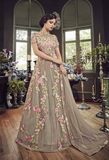 Flaunt Your Rich and Elegant Taste In Subtle Shade With This Heavy Designer Floor Length Suit In Grey Color Paired With Grey Colored Bottom And Dupatta. Its Top And Dupatta Are Fabricated On Net Paired With Santoon Bottom. It IS Beautified With Pretty Contrasting Embroidery Over The Top.