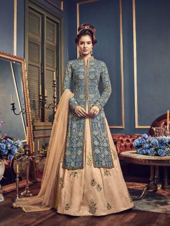 You Will Definitely Earn Lots Of Compliments Wearing This Designer Indo-Western Suit In Blue Colored Top Paired With Light Peach Colored Lehenga And dupatta. Its Top IS Fabricated On Georgette Paired With Art Silk Lehenga And Net Dupatta. Buy This Suit Now.