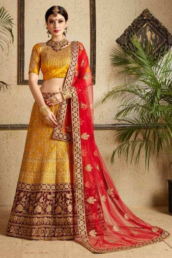 Celeberate This Festive And Wedding Season With This Heavy Designer Lehenga Choli In Musturd Yellow Color Paired With Contrasting Red Colored Dupatta. This Lehenga Choli Is Satin Based Fabric Paired With Net Fabricated Dupatta. Buy This Lehenga Choli Now.