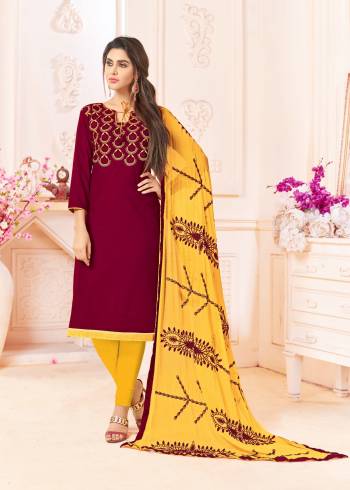 For A Rich Look, Grab This Dress Material In Maroon Color Paired With Contrasting Yellow Colored Bottom And Dupatta. Get This Cotton Based Dress Material Stitched As Per Your Desired Fit And Comfort.