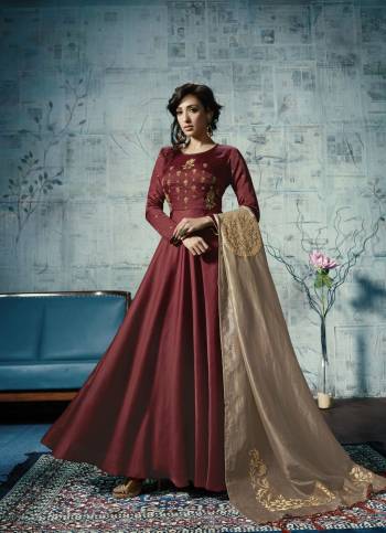 For A Rich And Royal Look, Grab This Designer Floor Length Readymade Gown In Maroon Color Fabricated On Linen Satin , It Is Paired With Beige Colored Embroidered Dupatta Which Is Fabricated On Orgenza Silk. Buy Now.